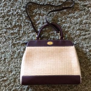 Leather and woven shoulder bag.